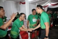 Agus Harimurti Yudhoyono menyalami dan menyapa sejumlah pejabat Kostrad Run 2026 yang digelar di kawasan Monumen Nasional