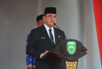 Sekda Sumsel memberikan sambutan Menteri Koperasi RI pada Apel Gabungan Hari Koperasi Nasional di Halaman Kantor Gubernur Sumatera Selatan, Palembang