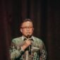 Kepala Dinas Kominfotik Provinsi Lampung Ganjar Jationo menyampaikan amanat tertulis Gubernur Lampung Rahmat Mirzani Djausal saat membuka Seminar Pekan Tuli Internasional 2026, Sabtu (26/9/2026).